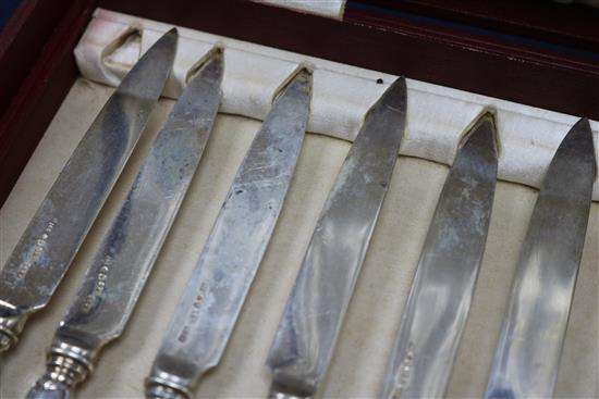 A cased set of twelve pairs of Swedish silver dessert eaters